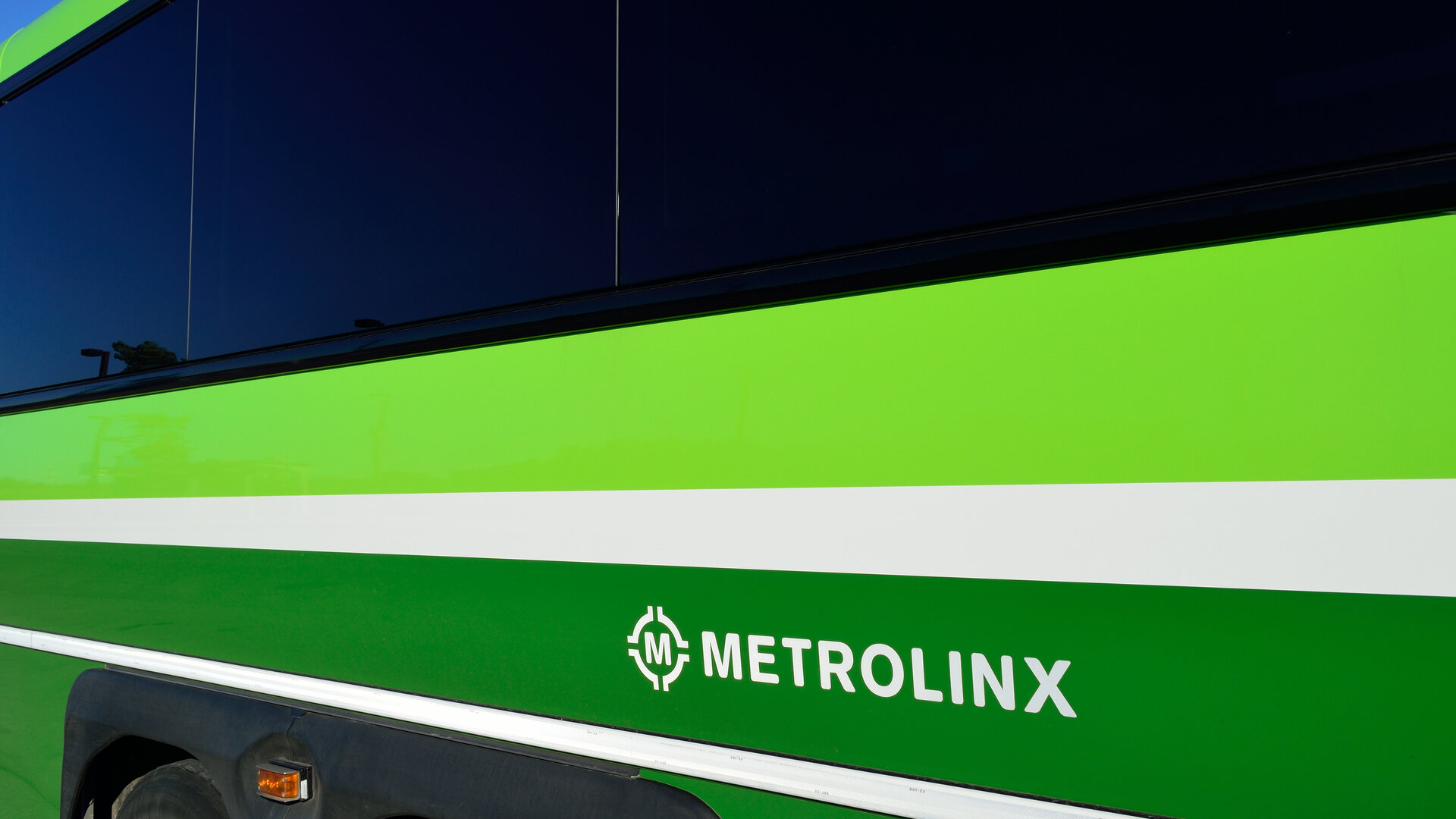 A green Metrolinx-branded vehicle showing the Metrolinx logo and wordmark.