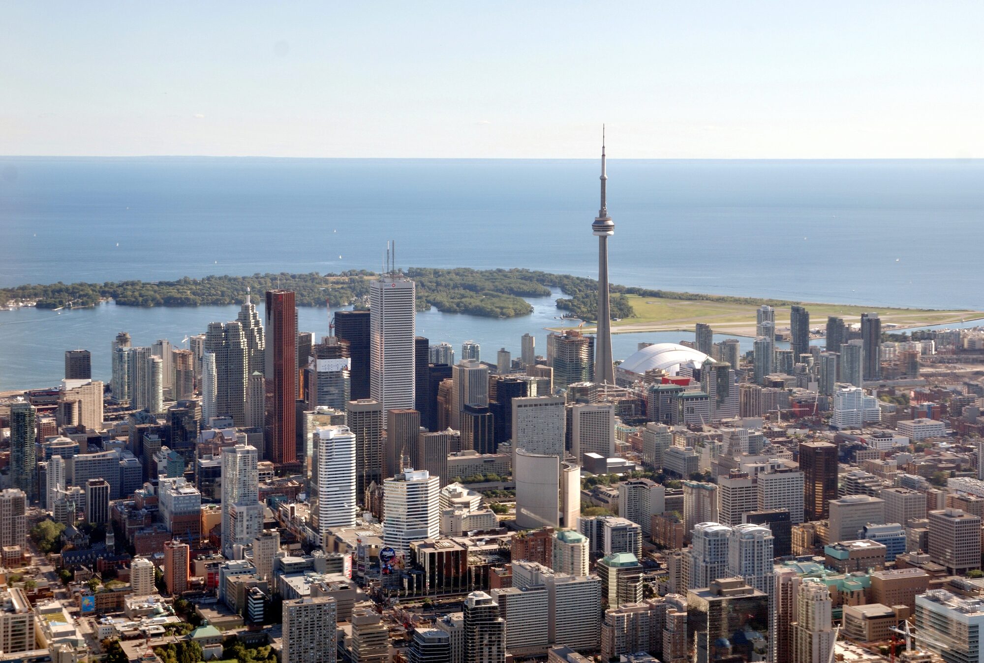 Toronto skyline over Lake Ontario — the largest of the metropolitan areas the 2026 Census will recount