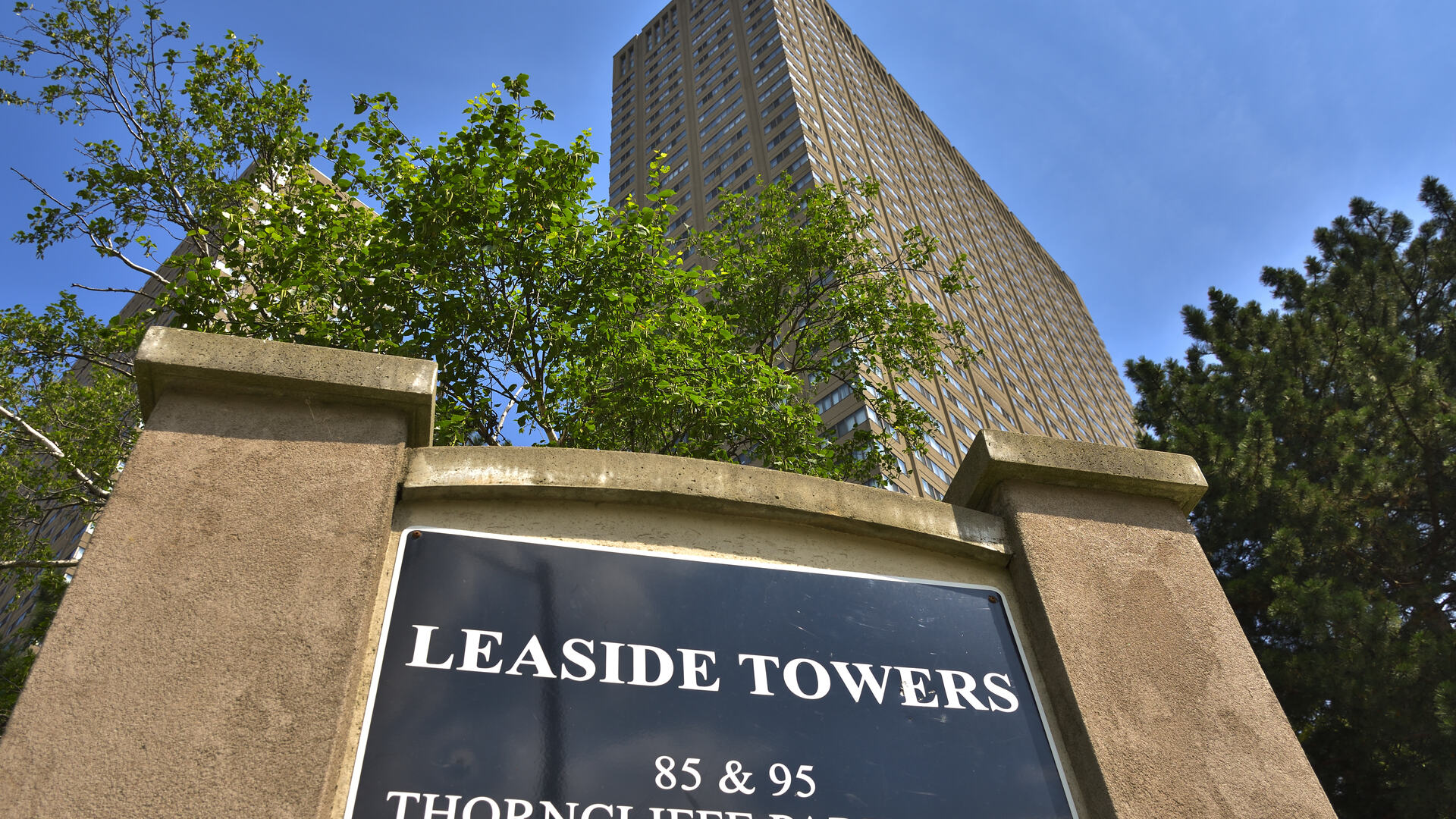 Leaside Towers, two high-rise rental apartment buildings at 85 and 95 Thorncliffe Park Drive in Toronto, seen from the entrance sign.