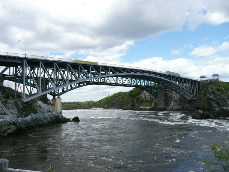 A bridge over a Canadian river with vehicles crossing.