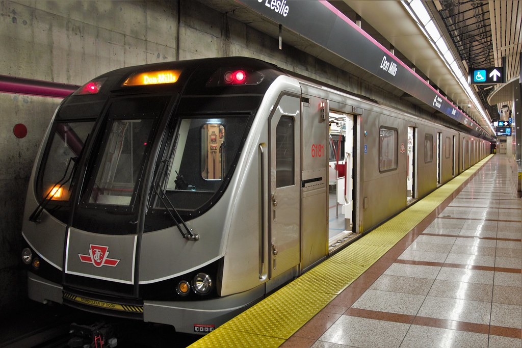 A TTC Toronto Rocket subway train pulling into Don Mills station.