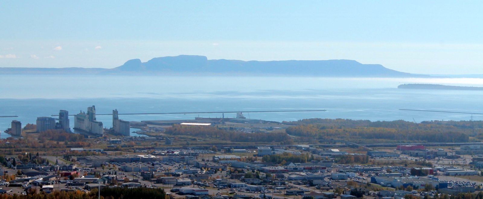 Thunder Bay, Ontario — wide view of the city with the Sleeping Giant peninsula on Lake Superior in the background.
